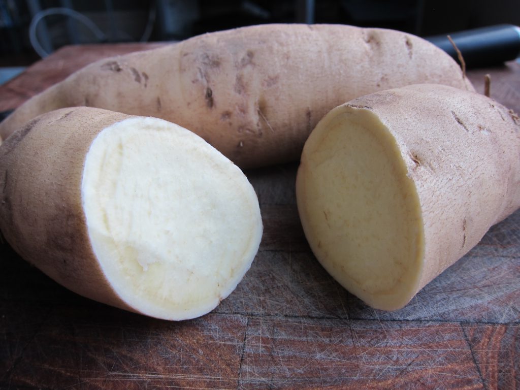 Photo with a yellow-skin sweet potato cut in half